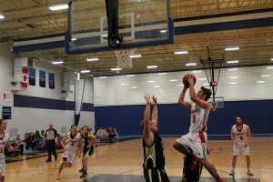Andrew Robart sinks a layup during play against Dal AC. Photo: The Baron