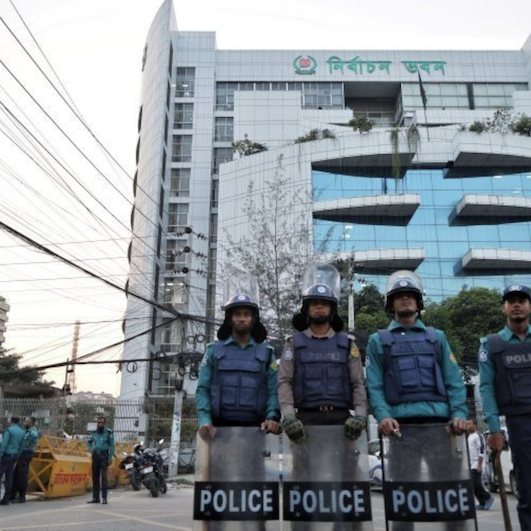 Policemen stand guard in front of the Bangladesh Election Commission office ahead of the general election schedule announcement in Dhaka, Bangladesh, December 11, 2025 [Mohammad Ponir Hossain/Reuters]